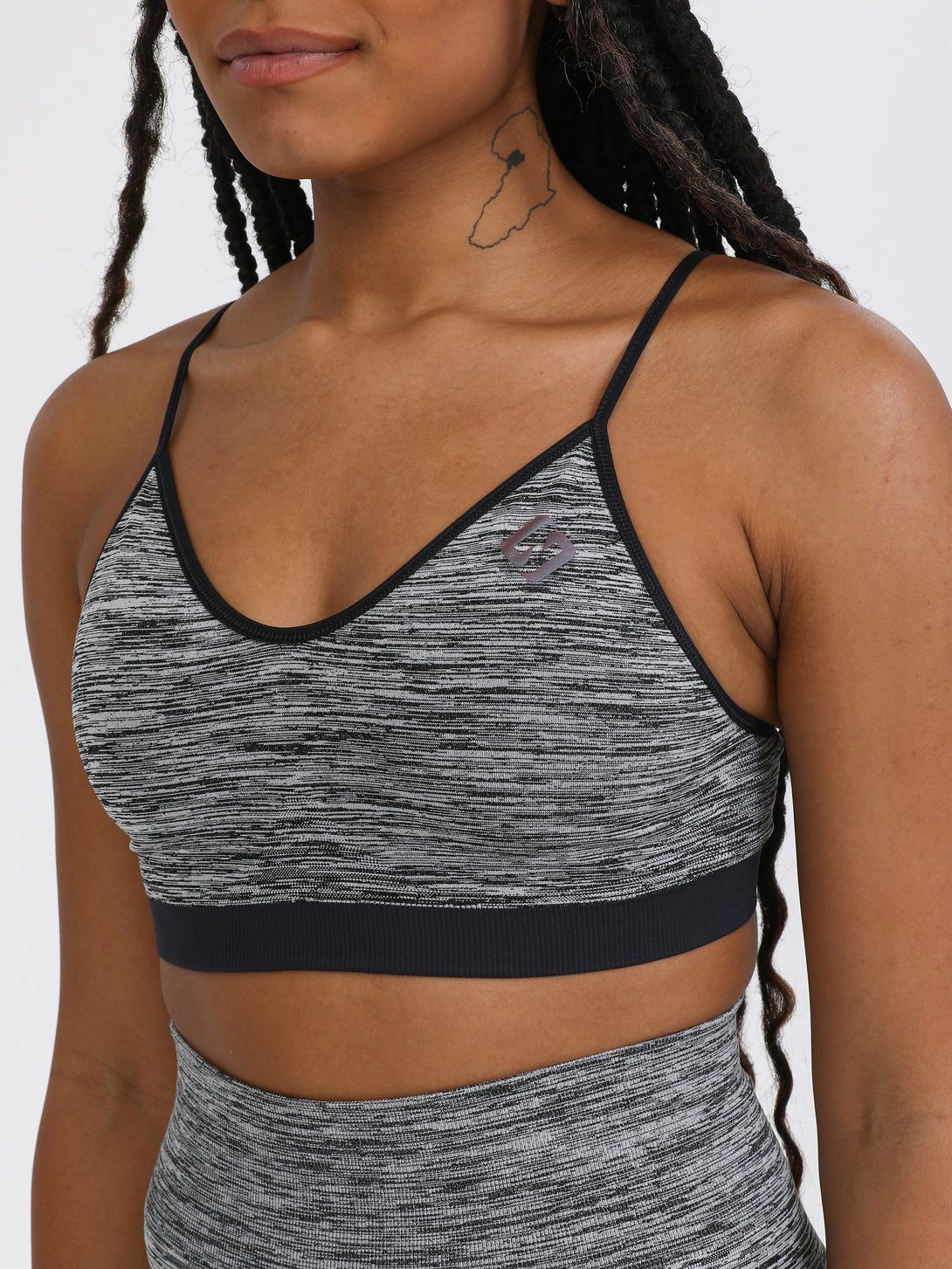 A Woman Wearing Black Color Seamless Reversible Light Support Sports Bra
