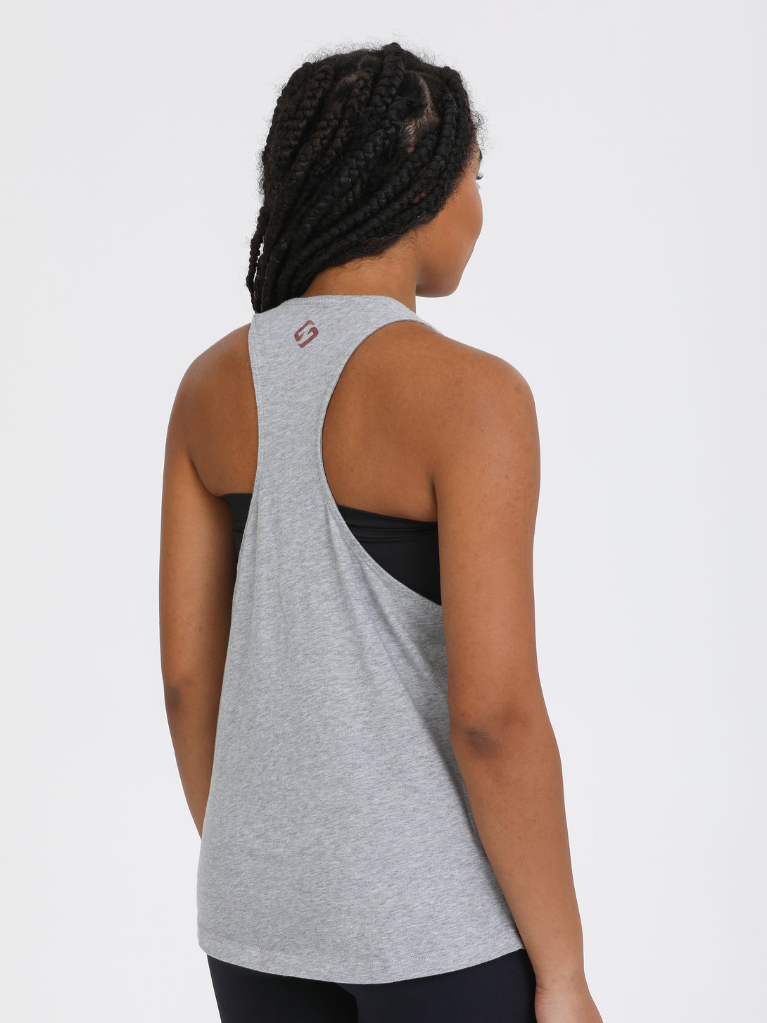 A Woman Wearing Light Grey Melange Color Sporty Jersey Tank Top & Tube Bra Set