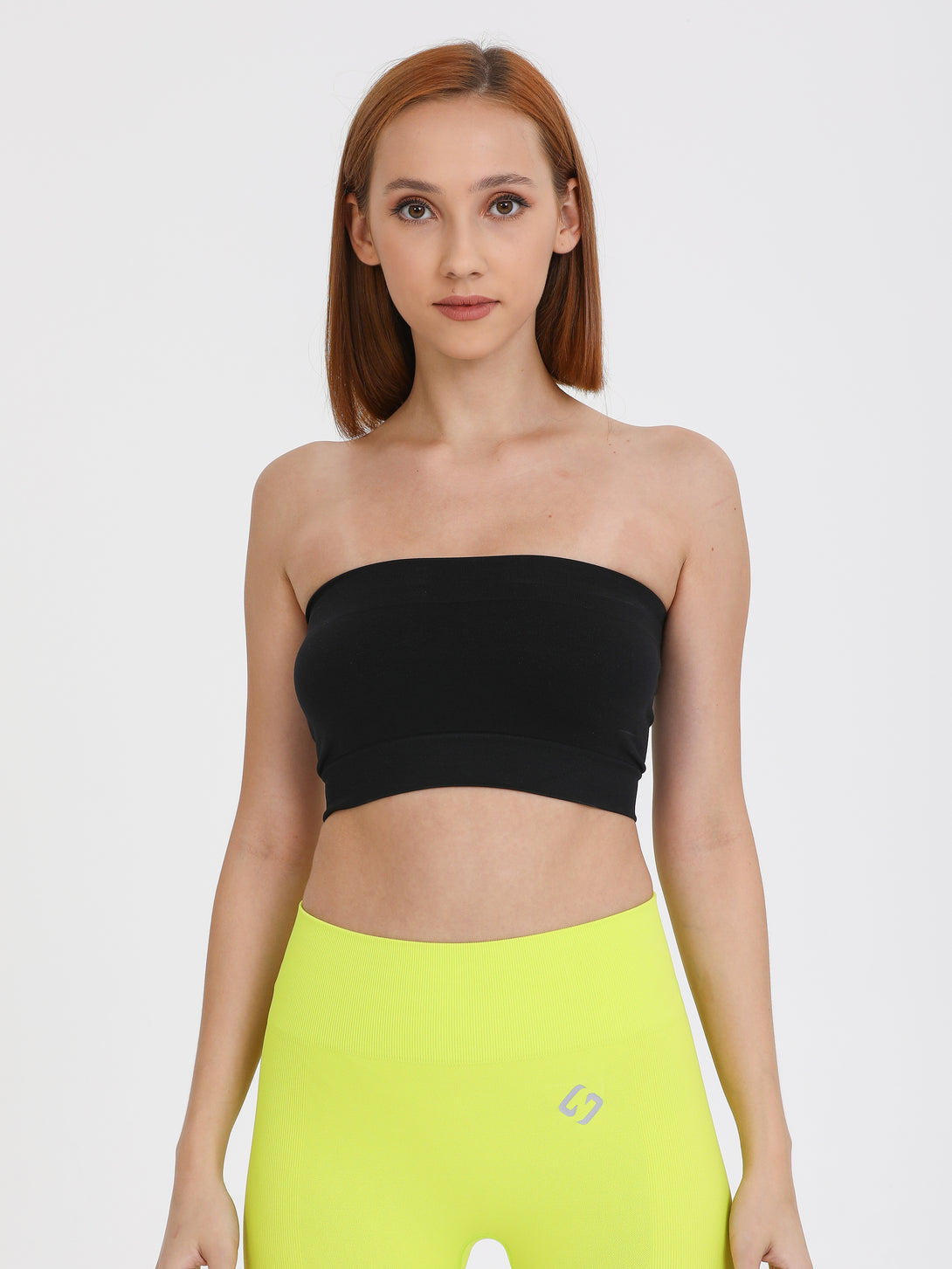 A Woman Wearing White Color Sport Jersey Tank Top & Tube Bra Set
