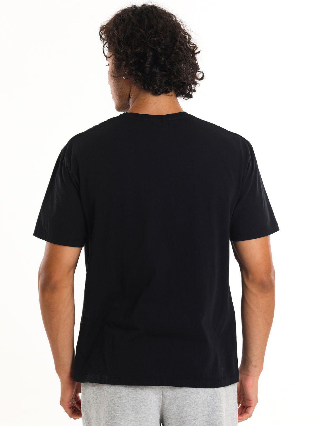 A Man Wearing Black Color T-shirt