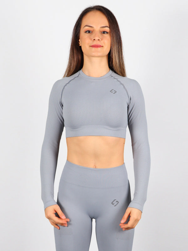 Color_Stone | A Woman Wearing Stone Color The Main Long Sleeve Crop Top