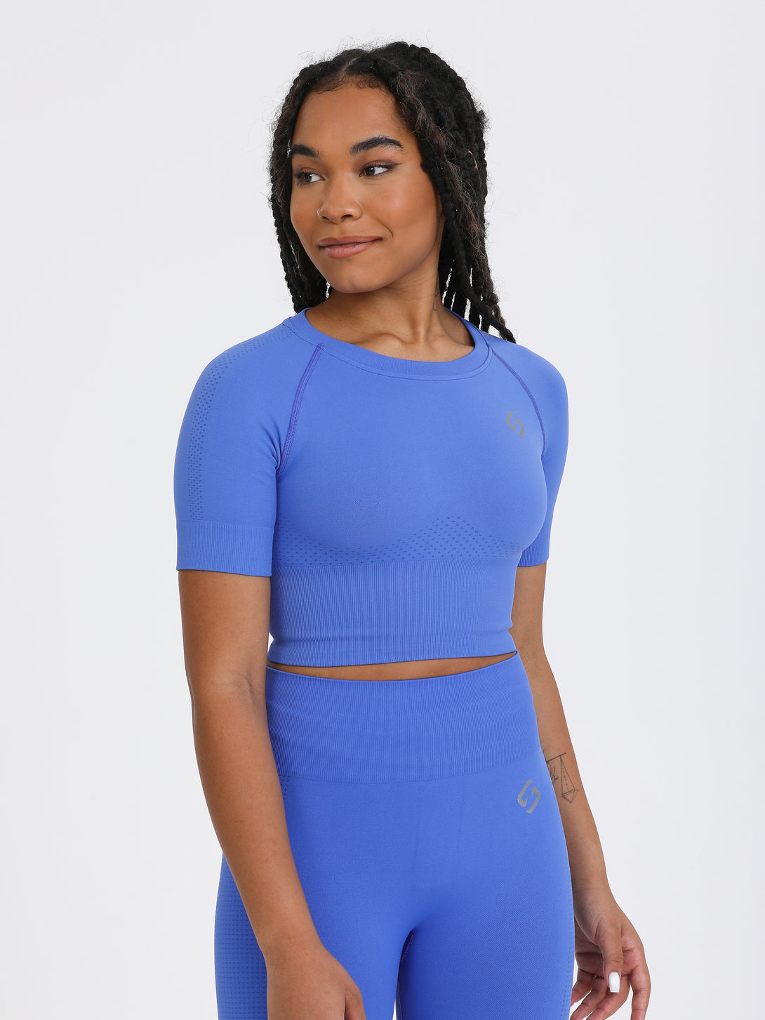 A Woman Wearing Amparo Blue Color The Main Short Sleeve Crop Top