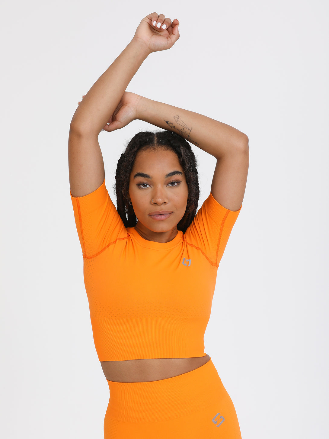 A Woman Wearing Orange Color The Main Short Sleeve Crop Top